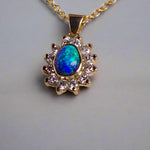 Vibrant sparkling 18K Yellow Gold Black Opal & Diamond Halo Pendant