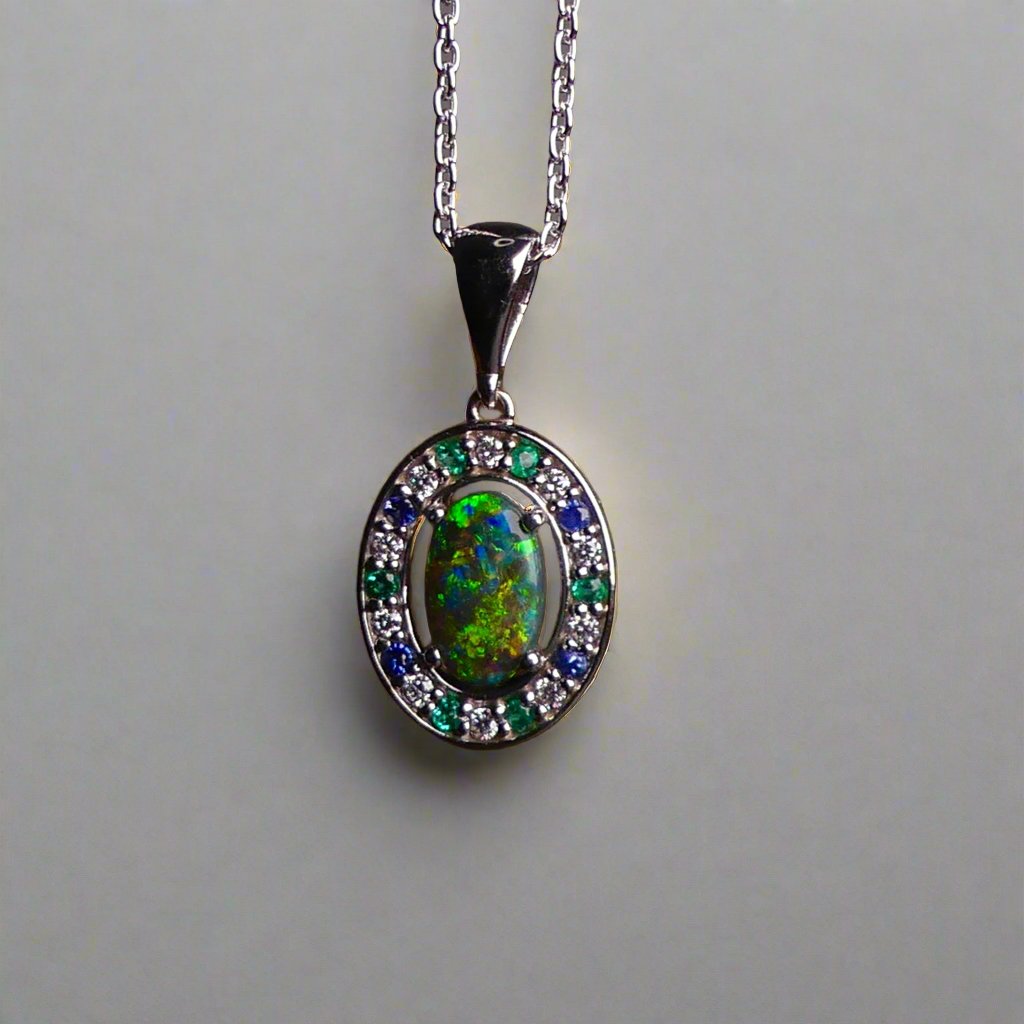 Luxurious White Gold Pendant with Black Opal, Diamonds, Emeralds & Sapphires