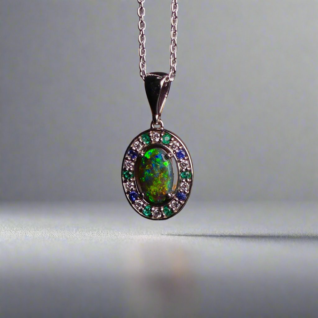 Luxurious White Gold Pendant with Black Opal, Diamonds, Emeralds & Sapphires