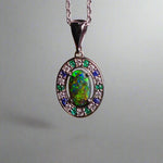 Luxurious White Gold Pendant with Black Opal, Diamonds, Emeralds & Sapphires