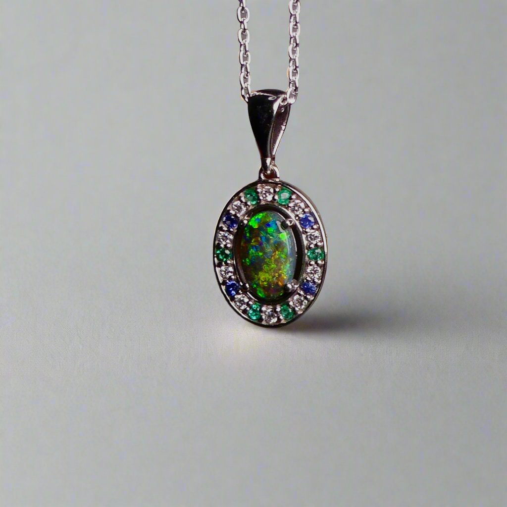 Luxurious White Gold Pendant with Black Opal, Diamonds, Emeralds & Sapphires