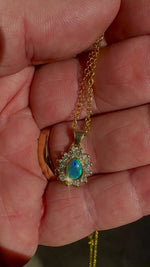 Vibrant sparkling 18K Yellow Gold Black Opal & Diamond Halo Pendant